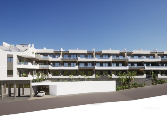 Modern new build 4-bedroom ground floor apartment building with balconies and parking in Benijofar under clear blue sky