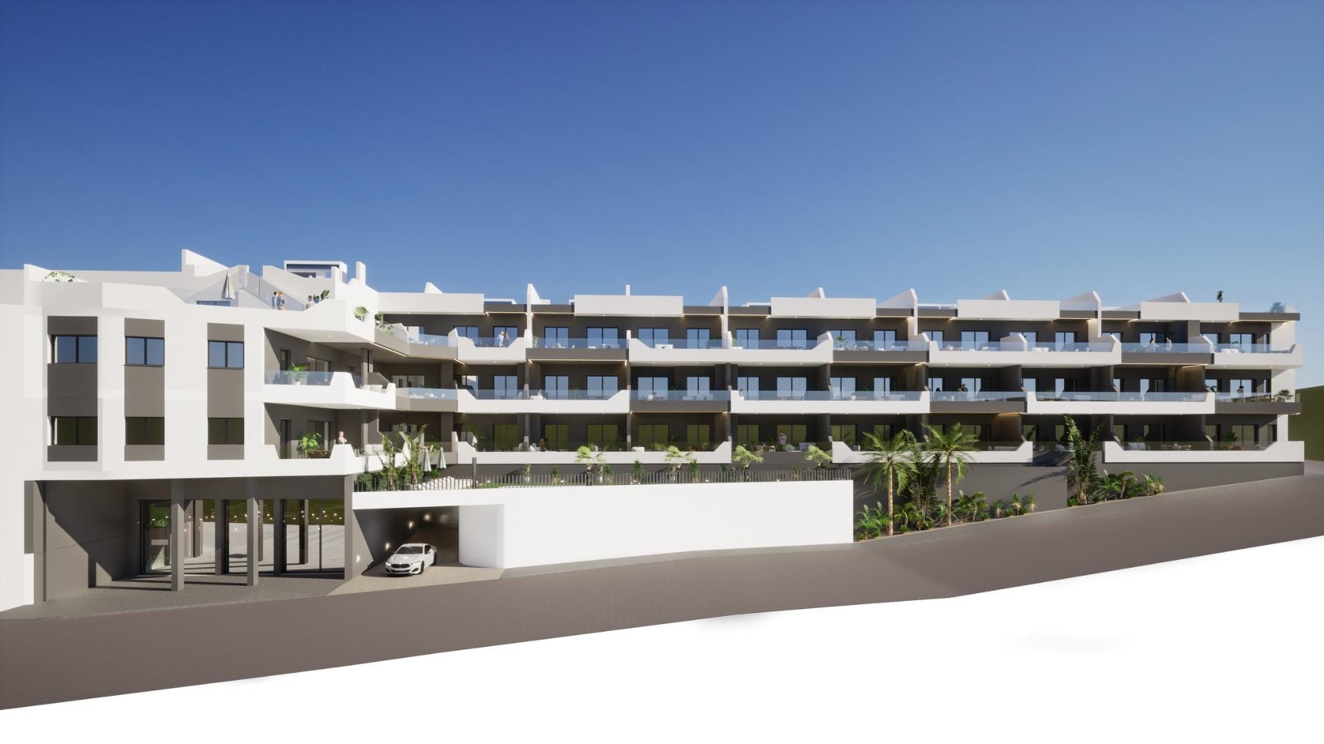 NEW BUILD BUILD RESIDENTIAL COMPLEX IN BENIJOFAR Modern new build 4-bedroom ground floor apartment building with balconies and parking in Benijofar under clear blue sky