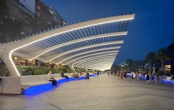 NEW-BUILD-RESIDENCIAL-IN-LOS-BALCONES-TORREVIEJA-19 Illuminated modern promenade near buildings in Los Balcones, Torrevieja, ideal for residents of the top floor apartment with solarium.