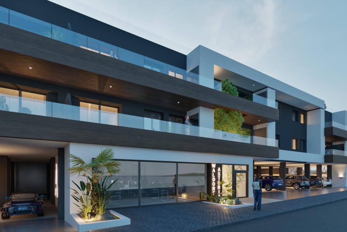 Modern exterior of spacious new build 3 bedroom apartment in Benijofar with balconies and covered parking at dusk.