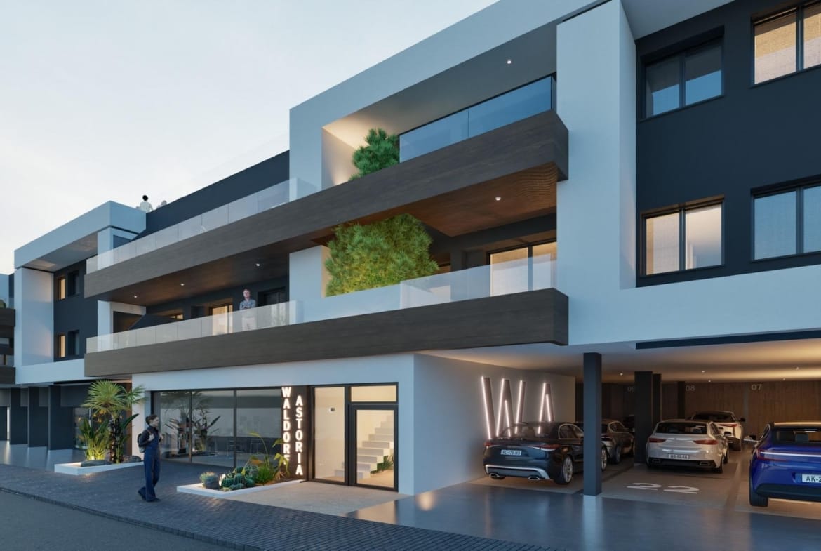 Modern exterior of spacious new build 3 bedroom apartment building with parking in Benijofar at dusk