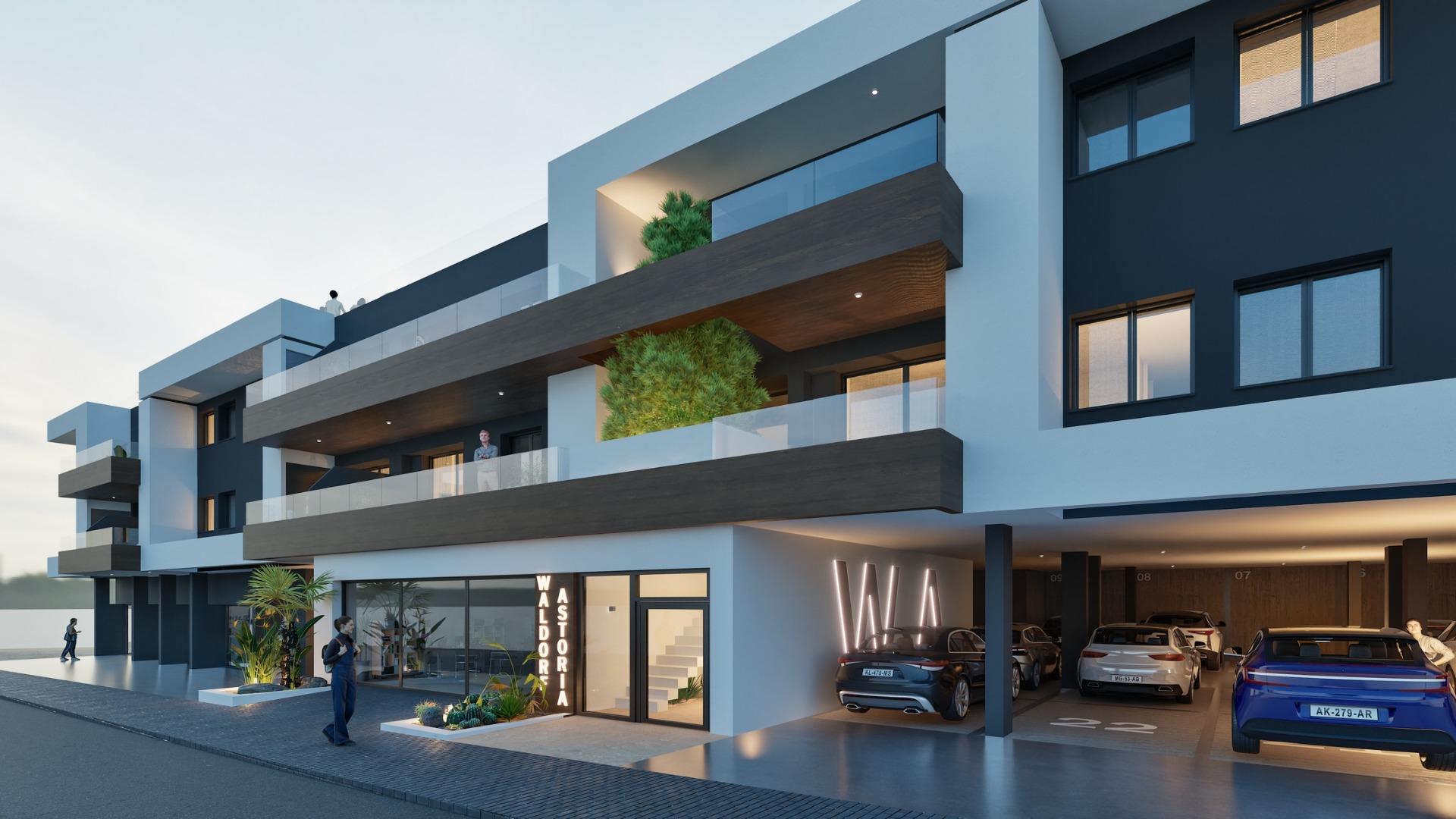 Modern exterior of a new build 2 bedroom ground floor apartment building in Benijofar with covered parking and balconies.