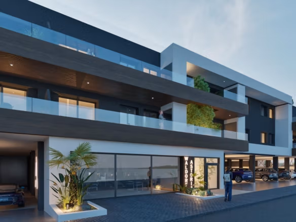 Modern exterior of elevated new build 2 bedroom top floor apartment with balconies in Benijofar at dusk