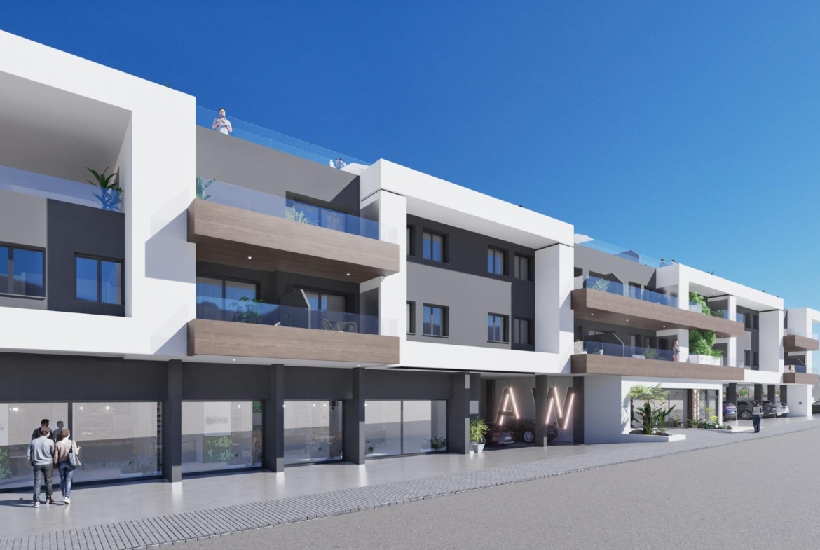 Modern exterior of a new build 2 bedroom ground floor apartment in Benijofar with balconies and clear blue sky.