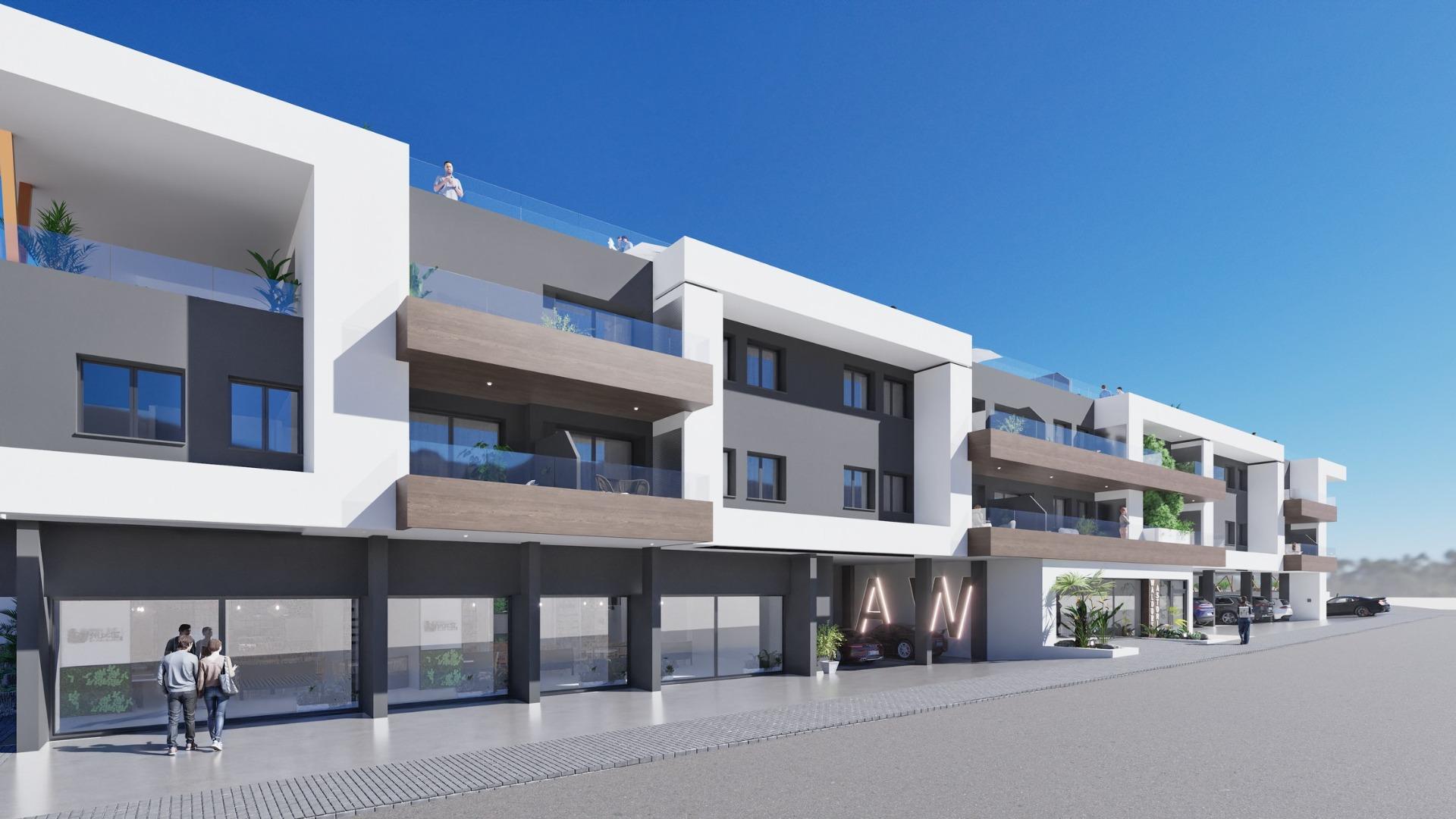 Modern exterior of a new build 2 bedroom ground floor apartment in Benijofar with balconies and clear blue sky.