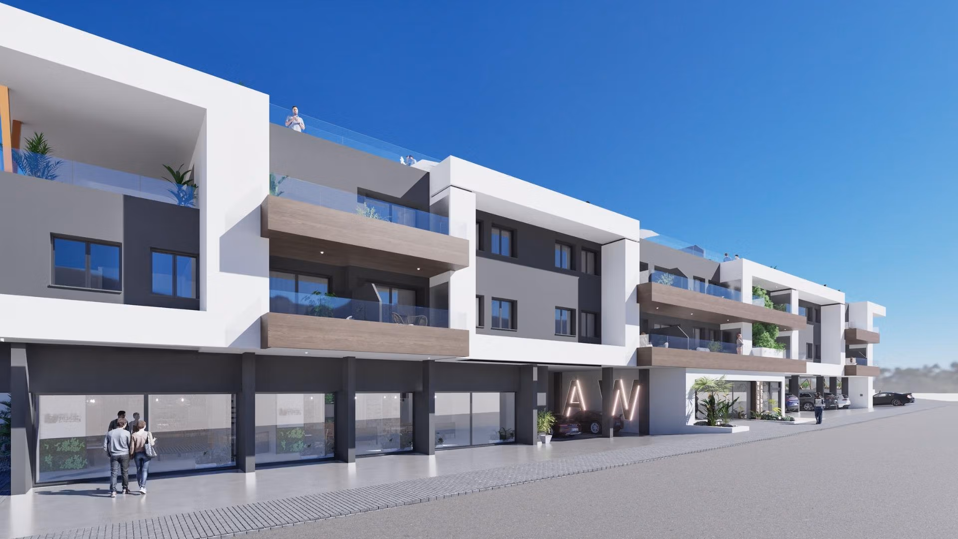 NEW-BUILD-RESIDENTIAL-IN-BENIJOFAR-3 Modern three-story building with balconies and storefronts, home to a new build 2 bedroom top floor apartment in Benijofar.