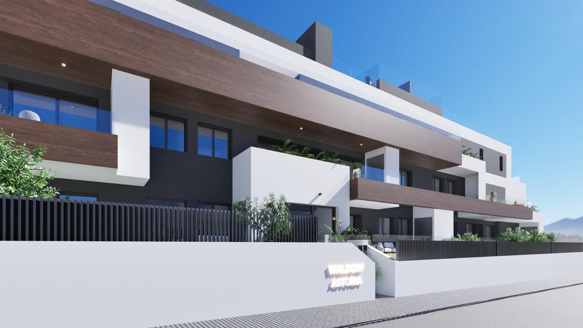 Exterior view of a modern new build 2 bedroom apartment in Benijofar, Alicante with balconies and glass railings.