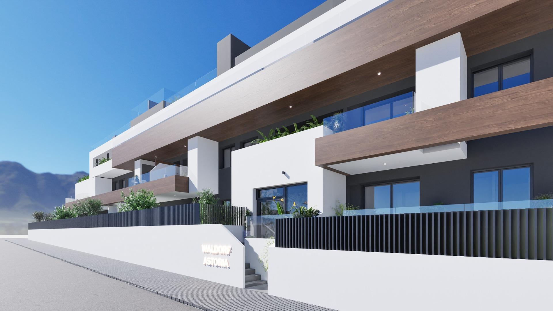 Modern exterior view of new build 2 bedroom ground floor apartment with balconies in Benijofar under clear sky