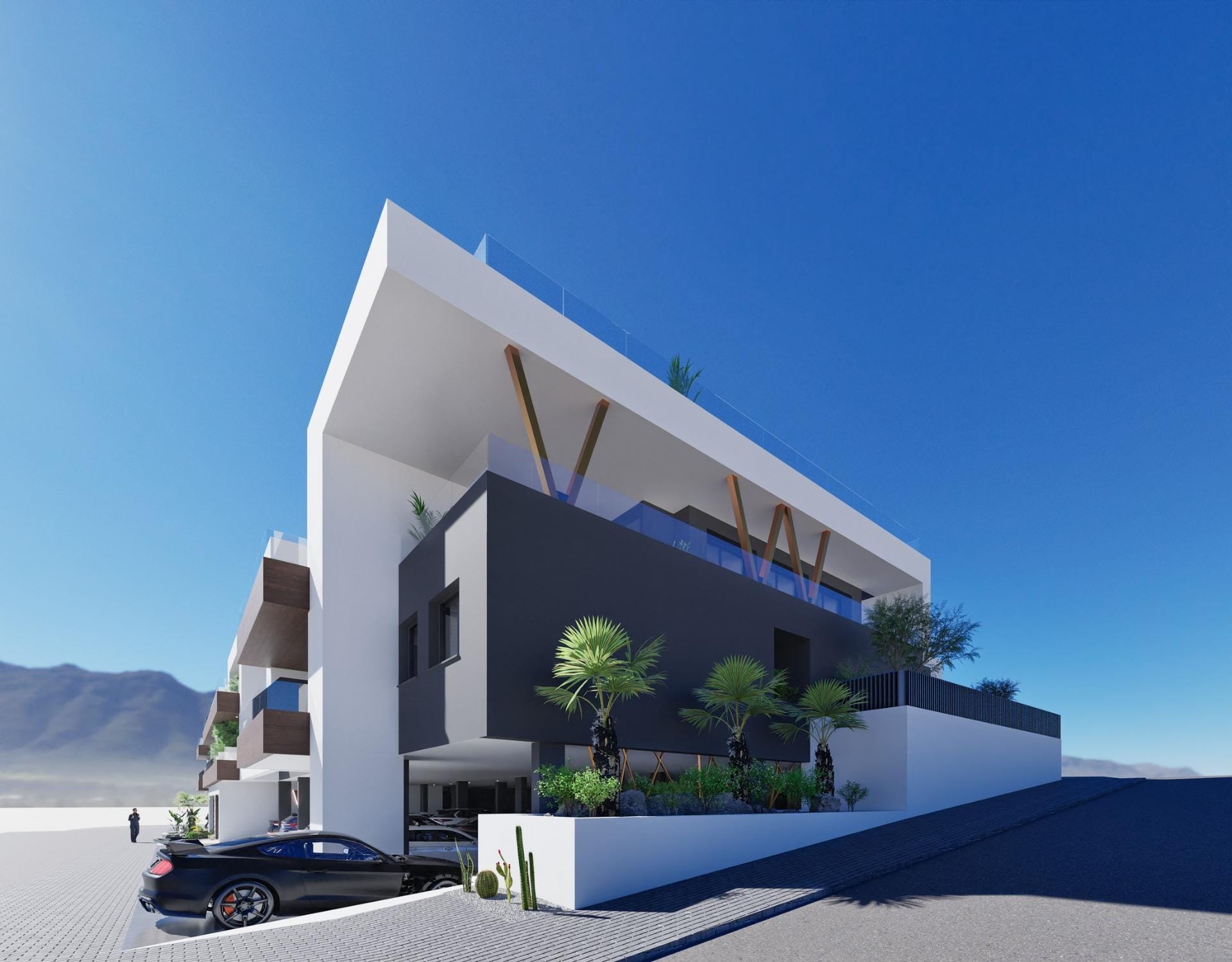 Modern elevated new build 2 bedroom top floor apartment with solarium and parking in Benijofar under clear blue sky