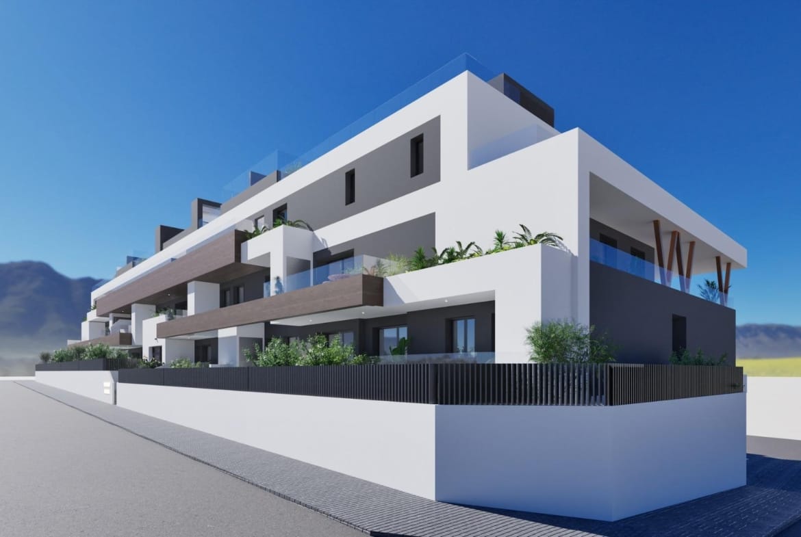 Modern white and gray 2-bedroom new build apartment exterior in Benijofar, Alicante with balconies and mountain views.