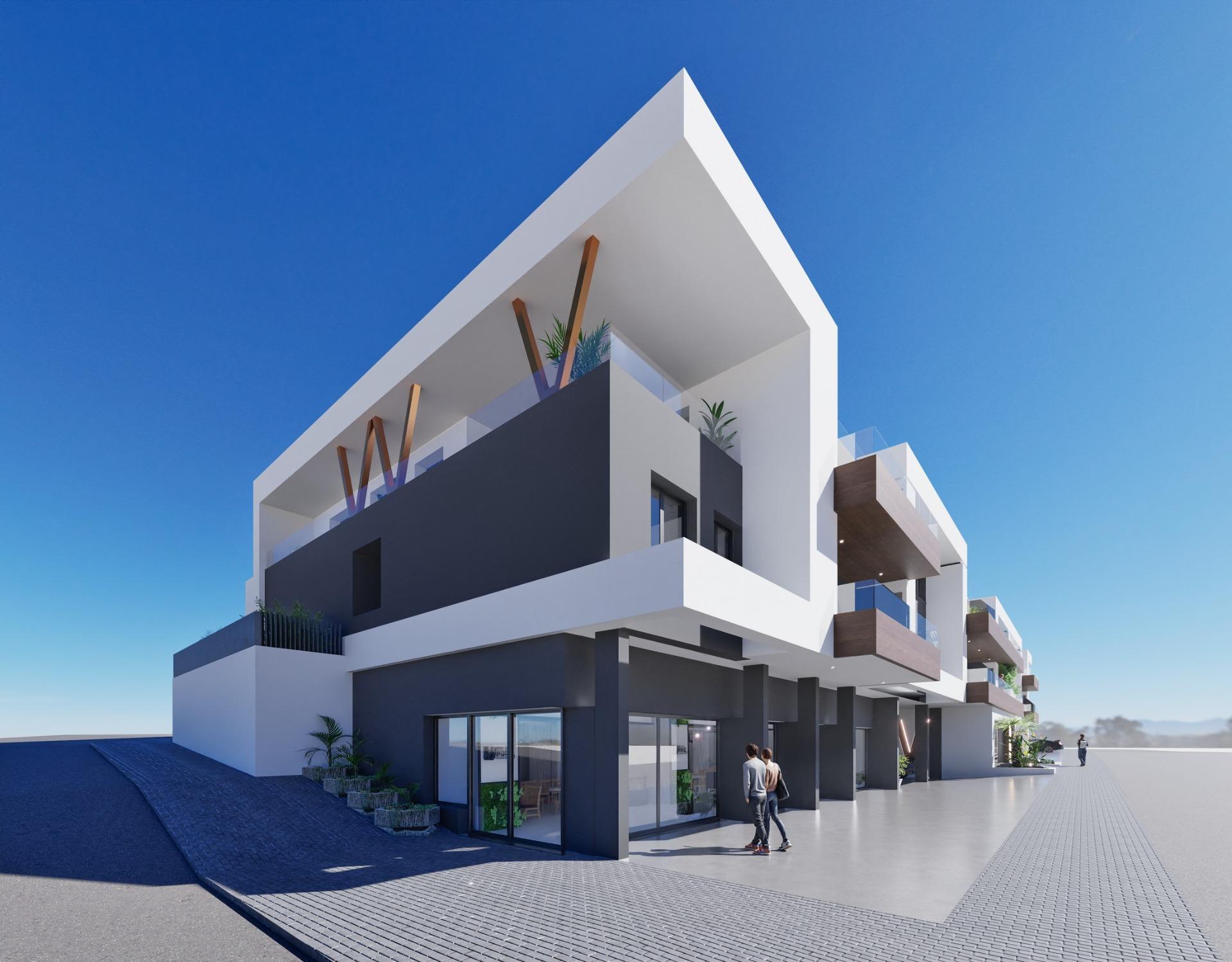Modern exterior of a new build 2 bedroom ground floor apartment in Benijofar with spacious terrace under clear blue sky