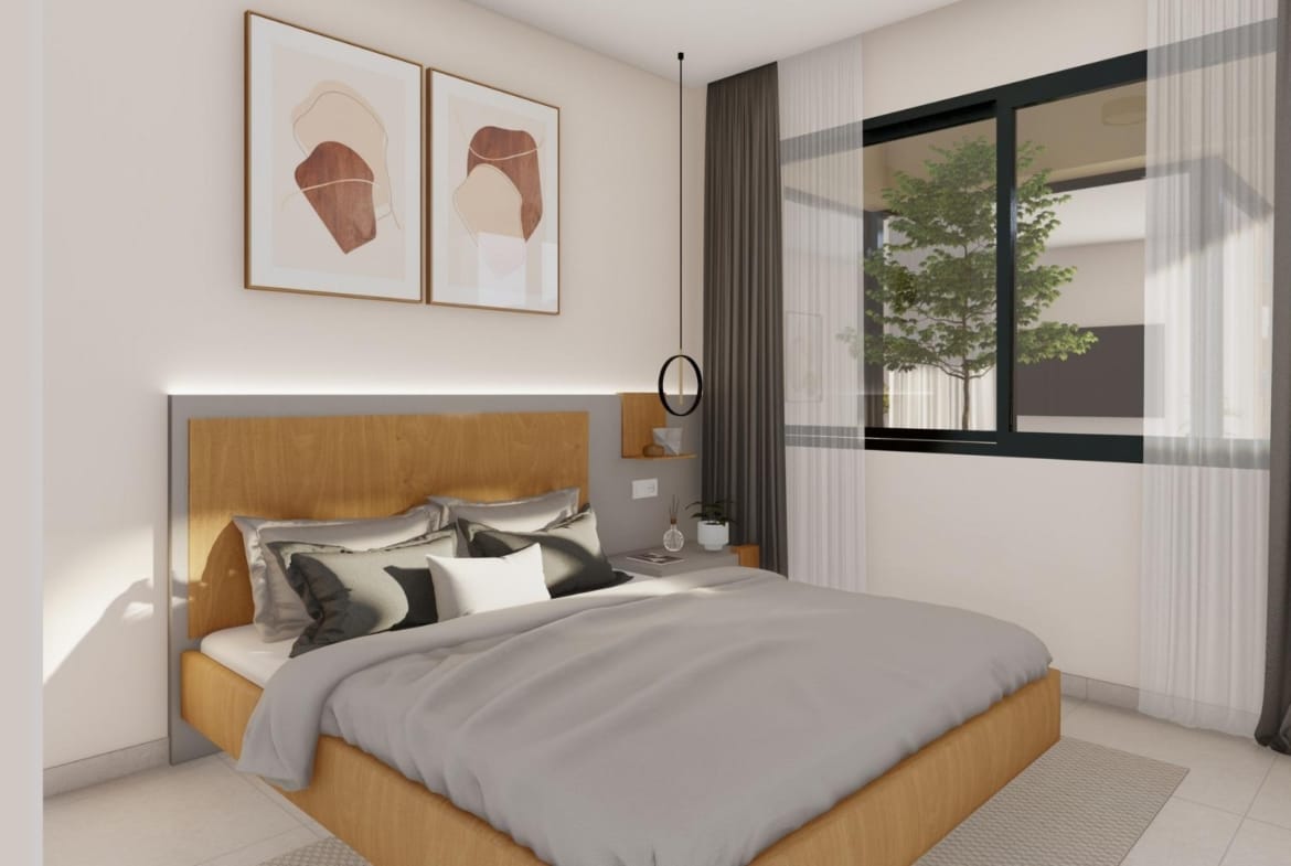 Modern bedroom with large bed and window in elegant new build villa at Altaona Golf Resort, Murcia