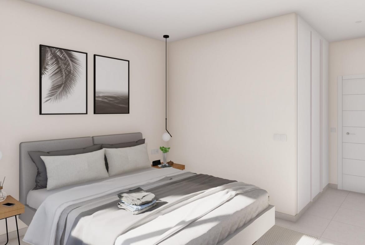 Modern bedroom with double bed and minimalist decor in an elegant new build villa in Altaona Golf Resort, Murcia