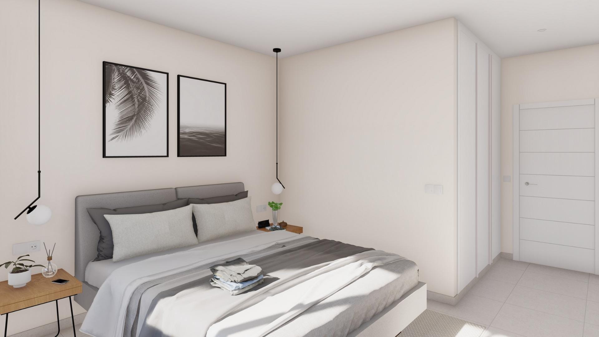 Modern bedroom with double bed and minimalist decor in an elegant new build villa in Altaona Golf Resort, Murcia
