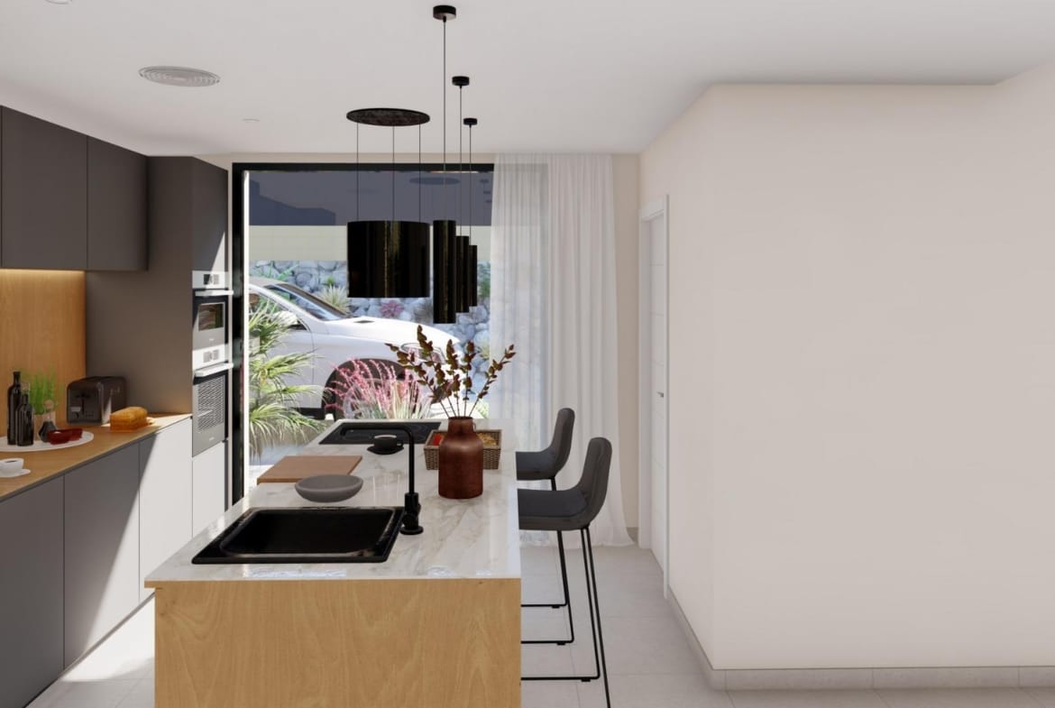 Modern kitchen with island and dining area in elegant new build villa at Altaona Golf Resort, Murcia.