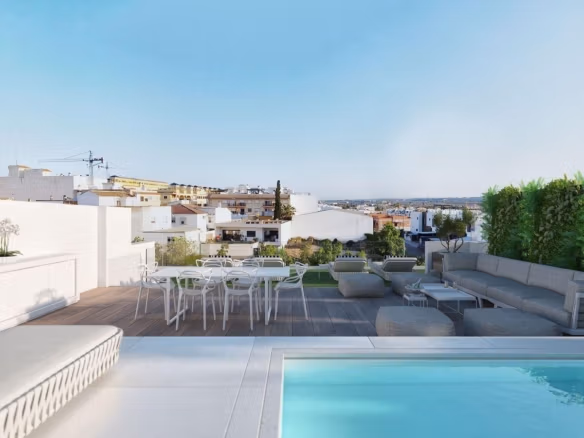 Spacious solarium with jacuzzi, seating area, and view over Benijofar rooftops in 2-bedroom Penthouse Neubau