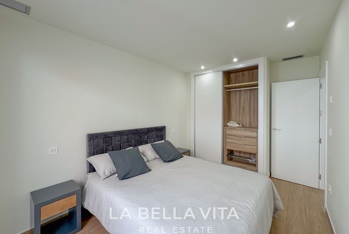 Bright and modern bedroom with built-in wardrobe in an elegant single-storey new build villa in Benijófar, Costa Blanca.
