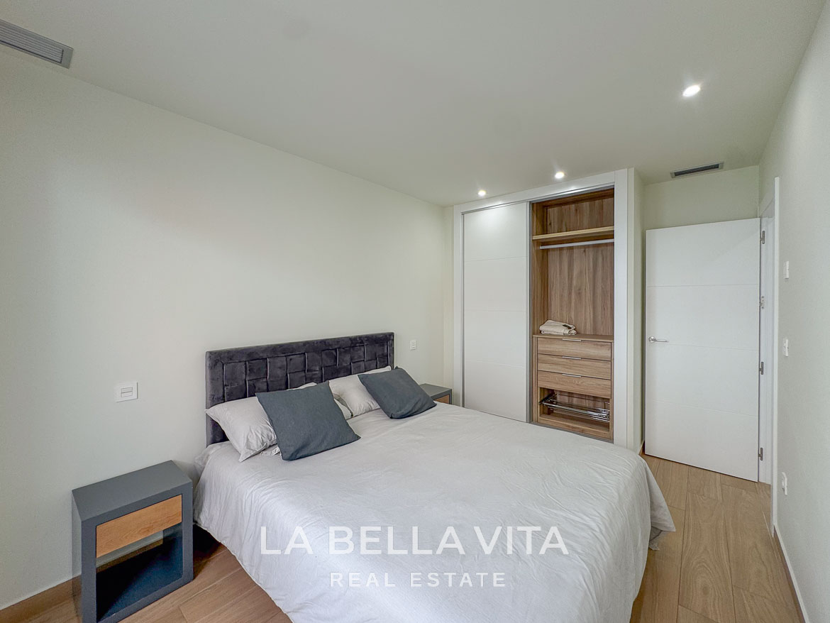Bright and modern bedroom with built-in wardrobe in an elegant single-storey new build villa in Benijófar, Costa Blanca.
