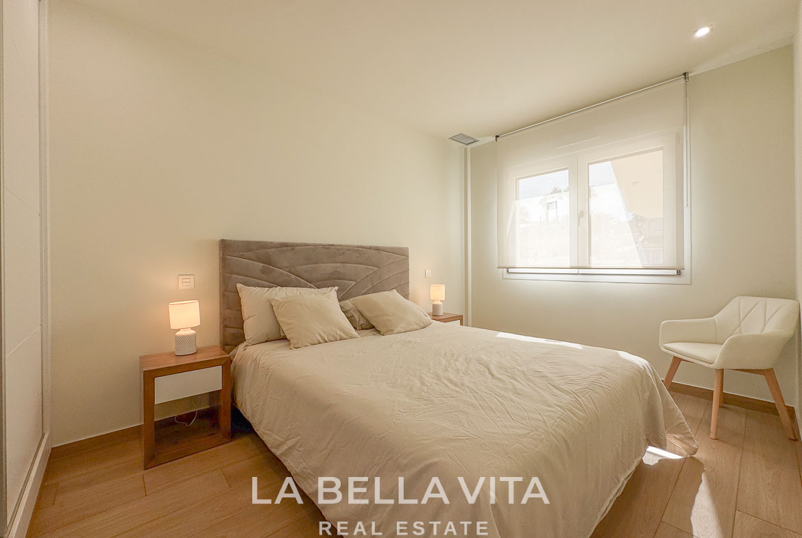 Bright and elegant bedroom with minimalist décor in luxury single-storey villa in Benijófar, Costa Blanca.