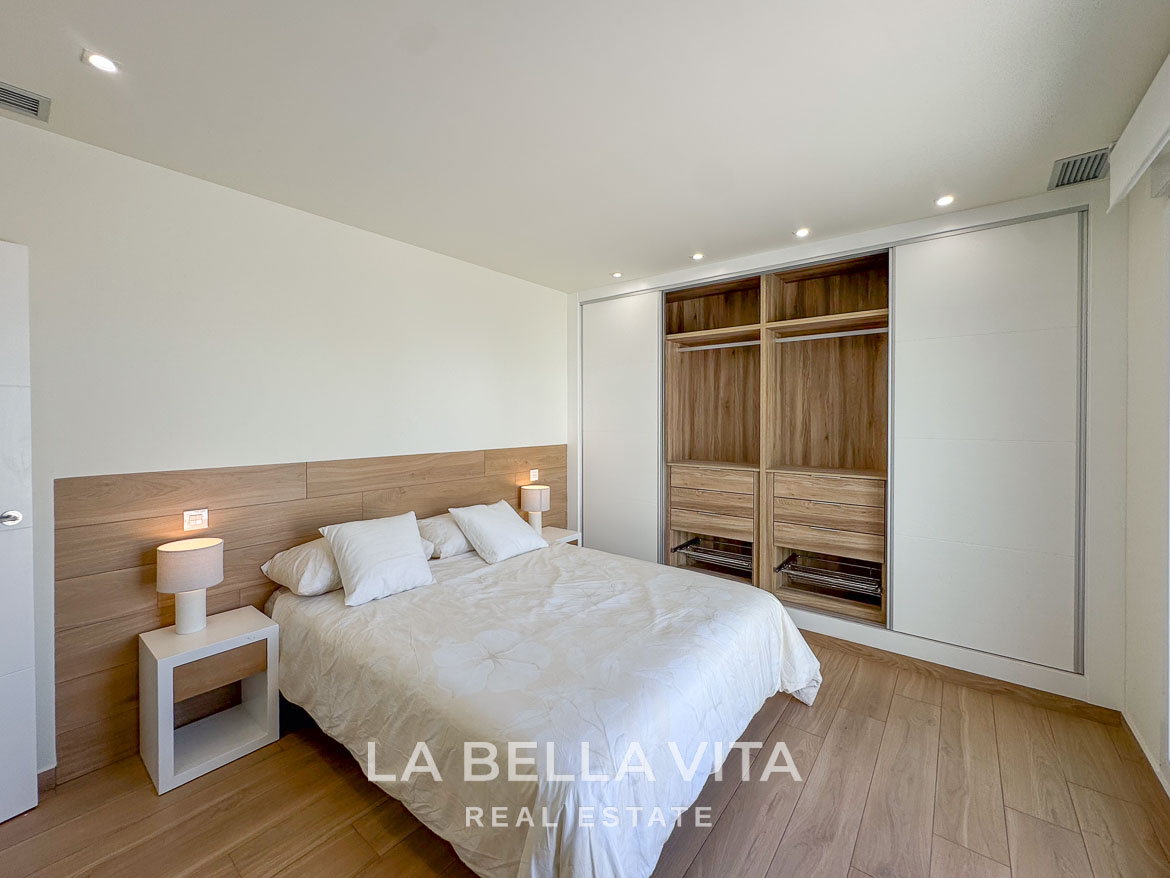 Bright elegant bedroom with modern built-in wardrobe in a luxury single-storey new build villa in Benijófar, Costa Blanca