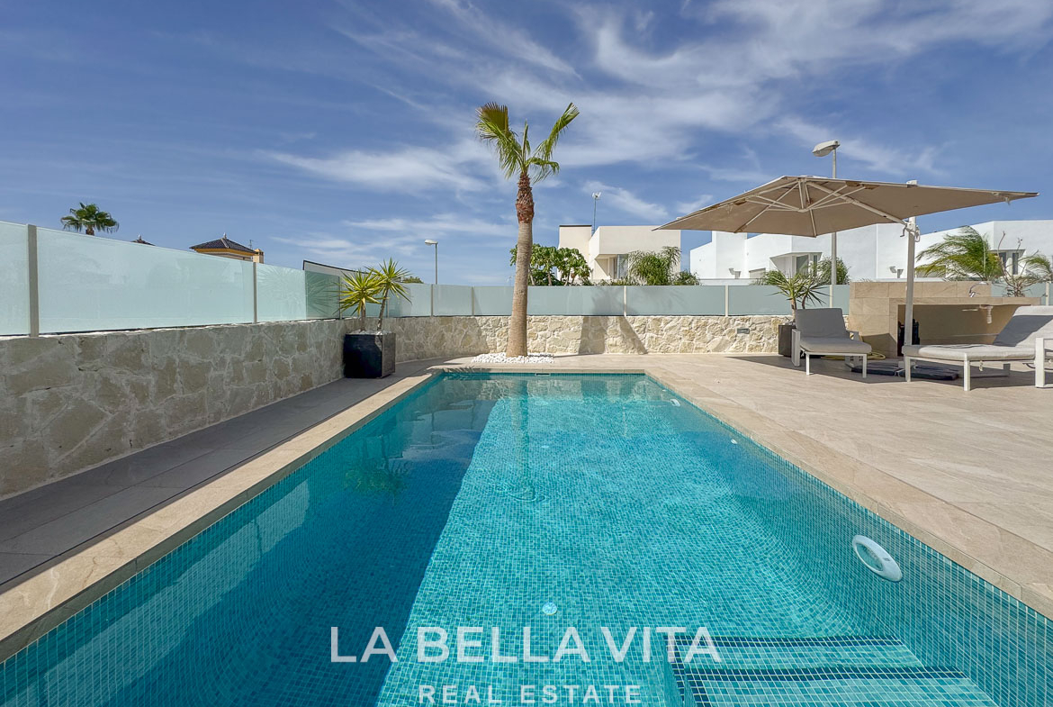 Sunlit private pool and stylish terrace of an elegant single-storey villa in Benijófar, Costa Blanca