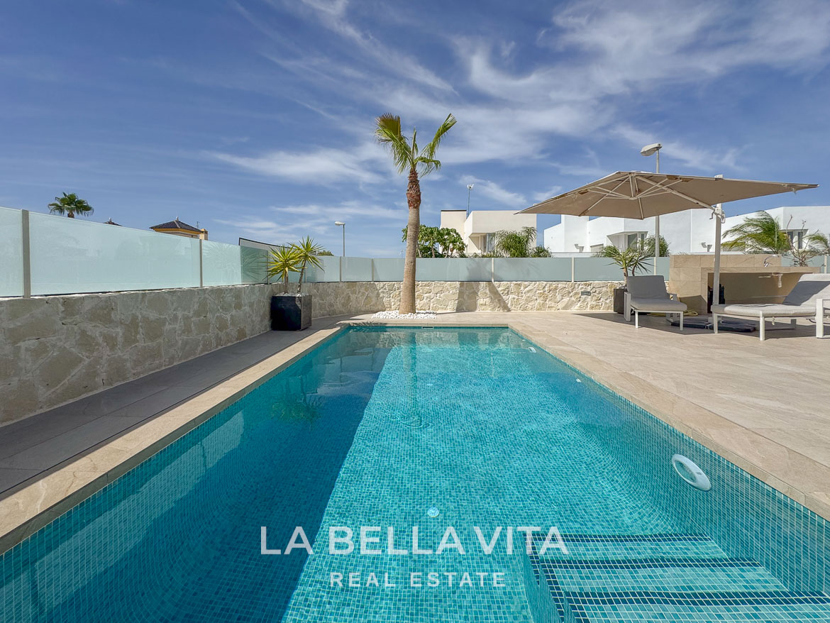 Sunlit private pool and stylish terrace of an elegant single-storey villa in Benijófar, Costa Blanca