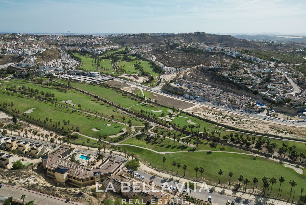 Stunning aerial view of an elegant single-storey villa with private pool overlooking lush golf course in Benijófar, Costa Blanca.