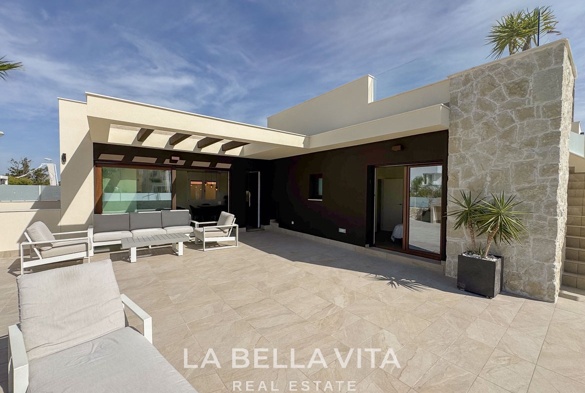 Spacious sun-drenched terrace with modern seating at elegant single-storey villa in Benijófar, Costa Blanca