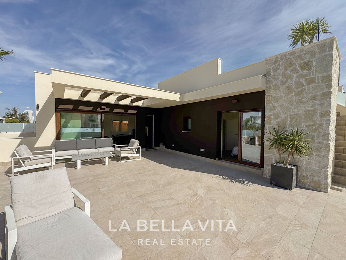 Spacious sun-drenched terrace with modern seating at elegant single-storey villa in Benijófar, Costa Blanca