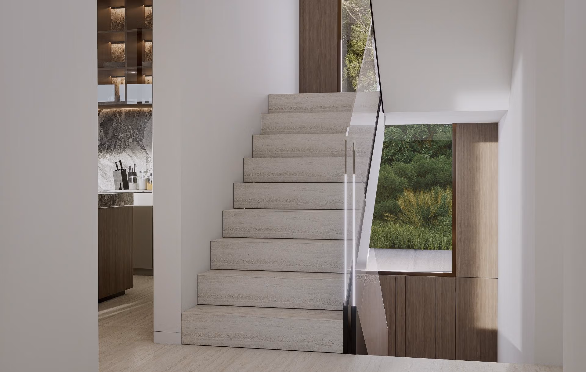 Interior stairway with glass railing in luxury villa at Las Colinas Golf Resort showing modern kitchen and greenery view.