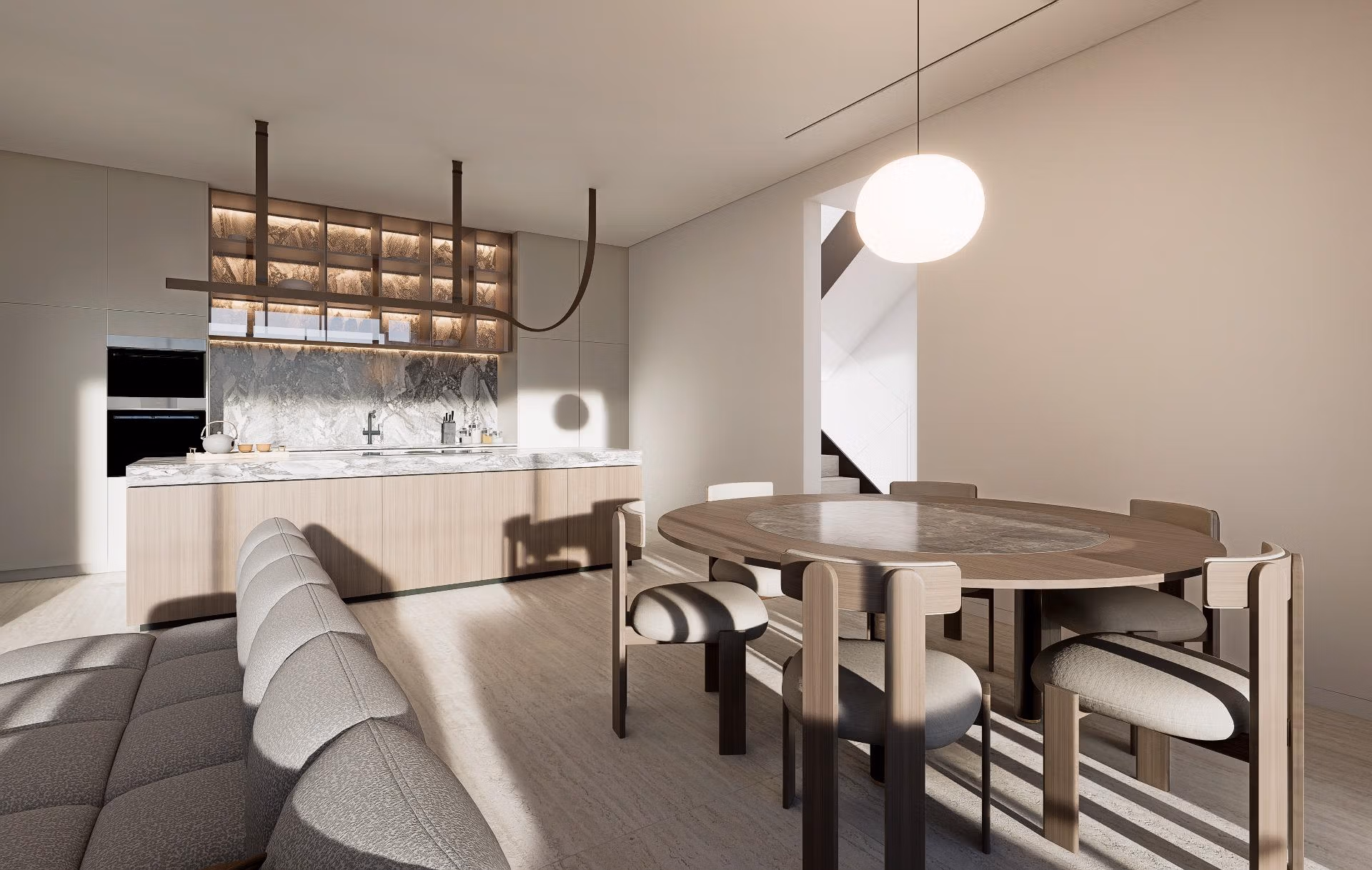 Modern dining area and kitchen in a luxury villa at Las Colinas Golf Resort with natural light and contemporary furnishings.
