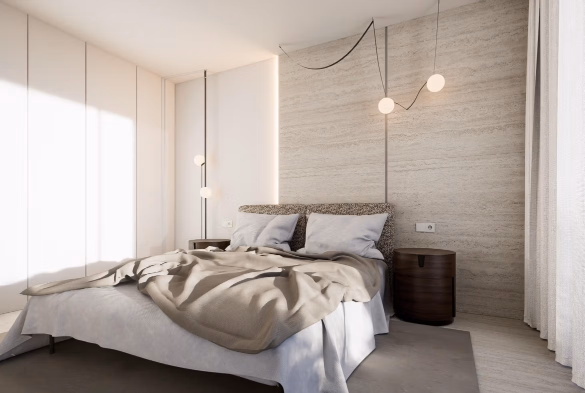 Modern bedroom with bed, bedside tables, and hanging lights in luxury villa at Las Colinas Golf Resort