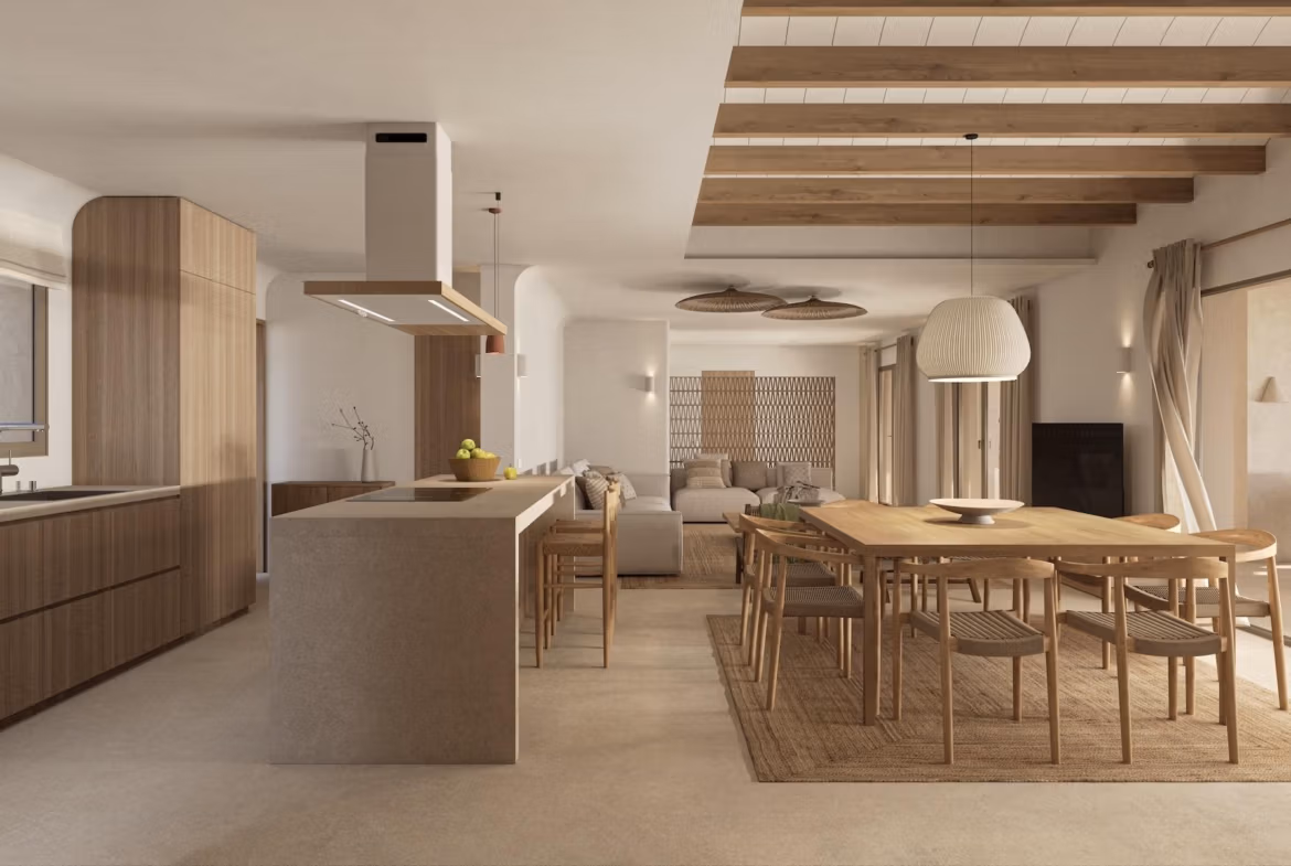 Bright open-plan kitchen and dining area in a refined single-storey villa with natural wood accents in La Fustera, Benissa.