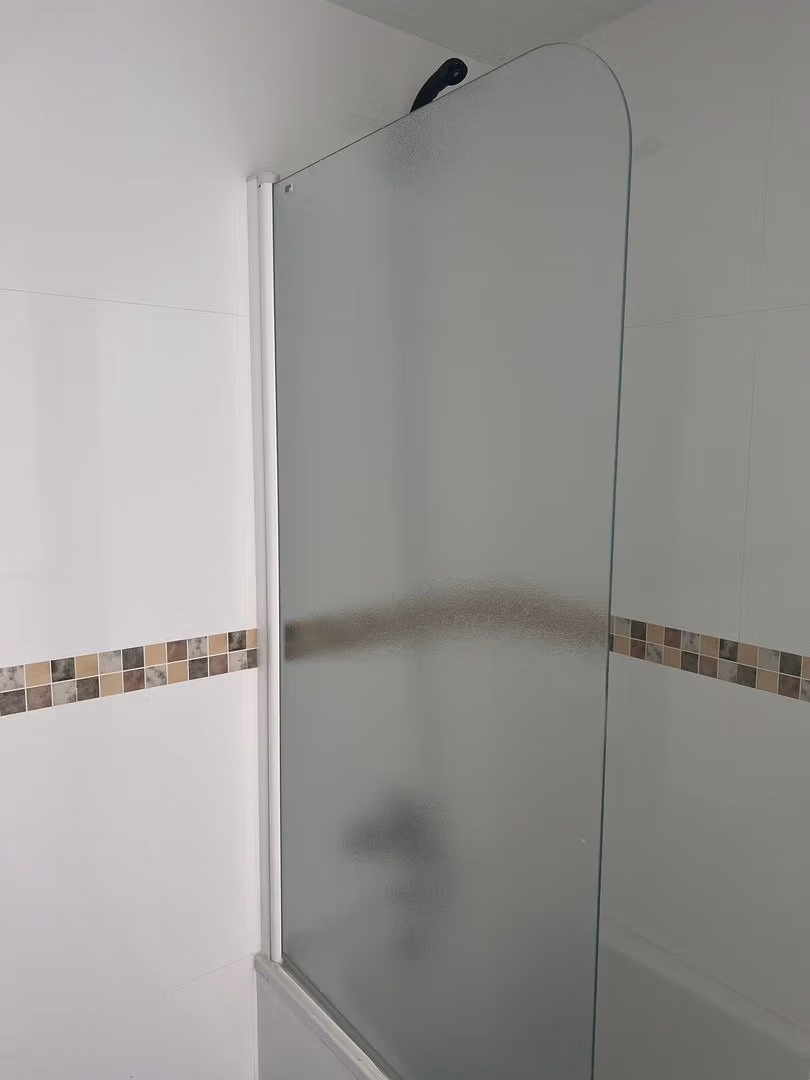Bright modern bathroom with frosted glass shower enclosure in luxury 3 bedroom penthouse in Calpe