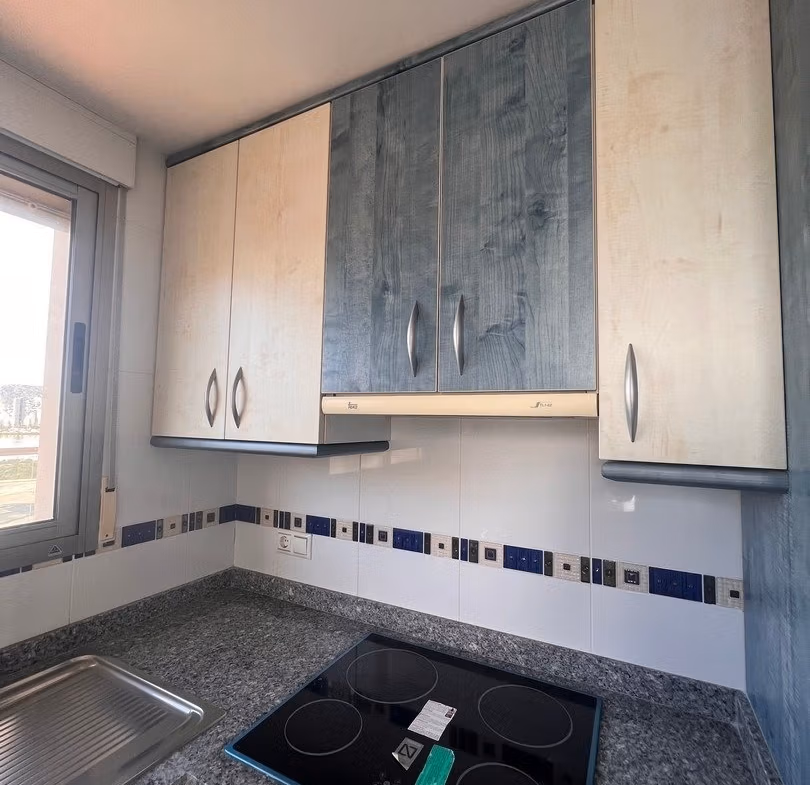 Compact modern kitchen with granite countertops in luxury 3 bedroom penthouse for sale in Calpe