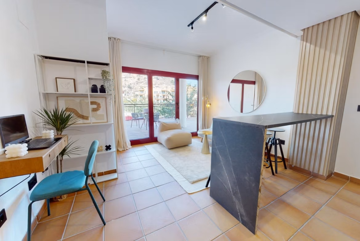Bright open-plan living area with modern kitchen island in charming 1-bedroom apartment for sale in Villanueva del Rio Segura