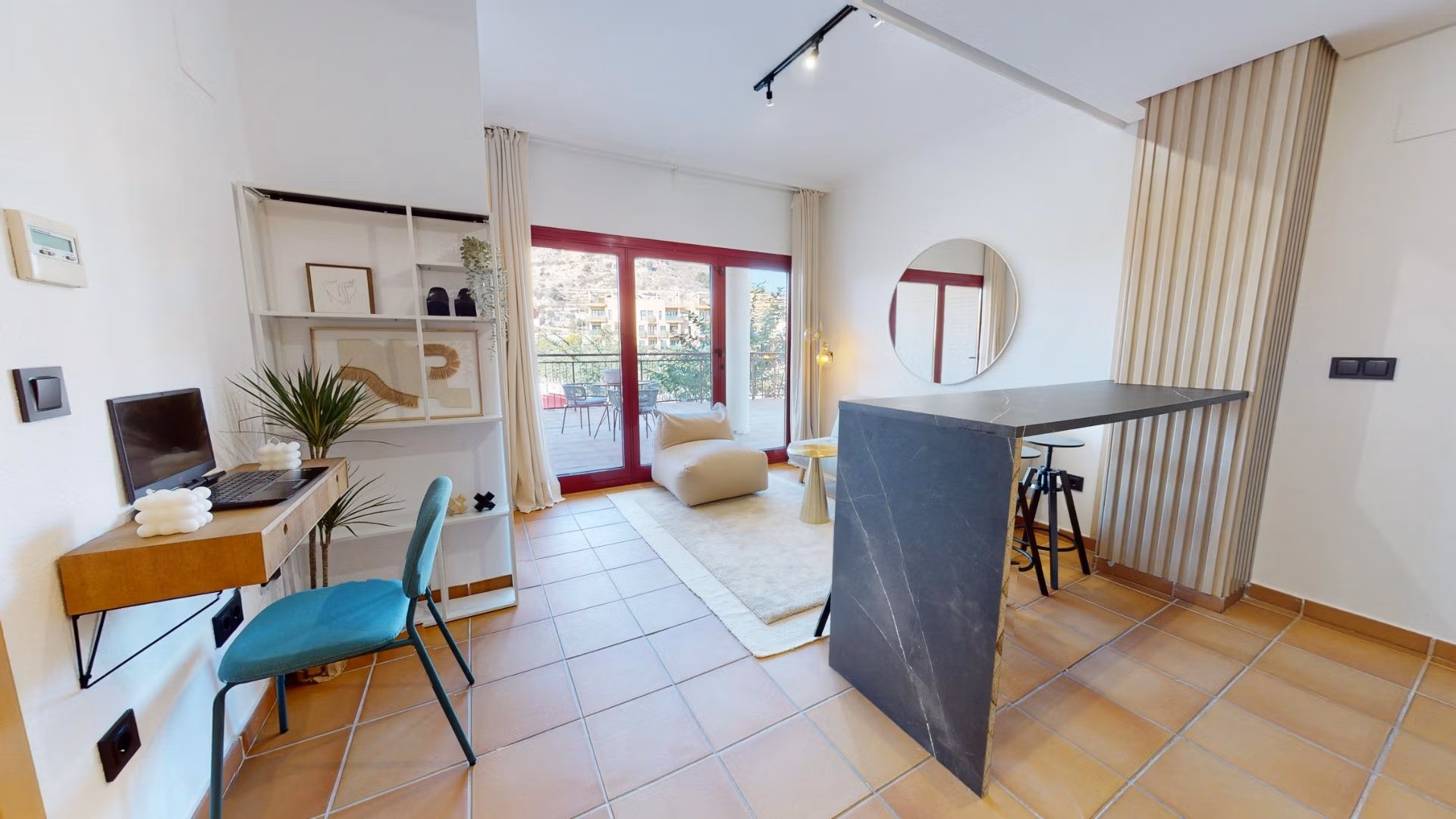 Bright open-plan living area with modern kitchen island in charming 1-bedroom apartment for sale in Villanueva del Rio Segura