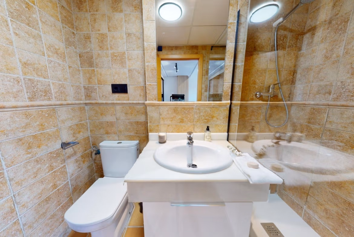 Bright, modern bathroom with sleek fixtures in a charming key ready 1-bedroom apartment in Villanueva del Rio Segura near Archena