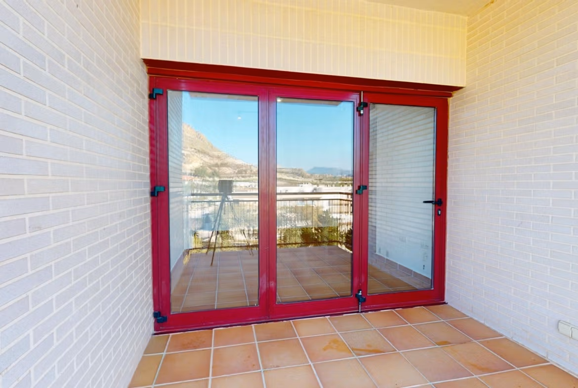 Bright sunlit terrace with terracotta tiles and panoramic mountain views in a charming 1-bedroom apartment in Villanueva del Rio Segura