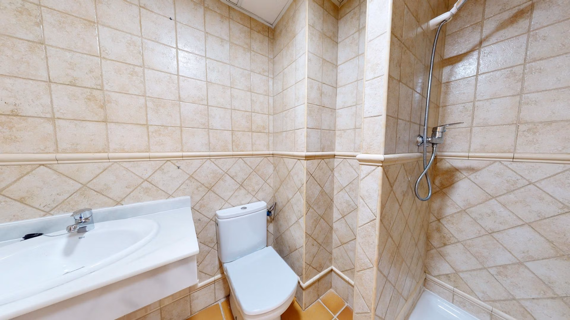 Compact modern bathroom with tiled walls and shower in a luxury 2-bedroom penthouse near Archena, Murcia.