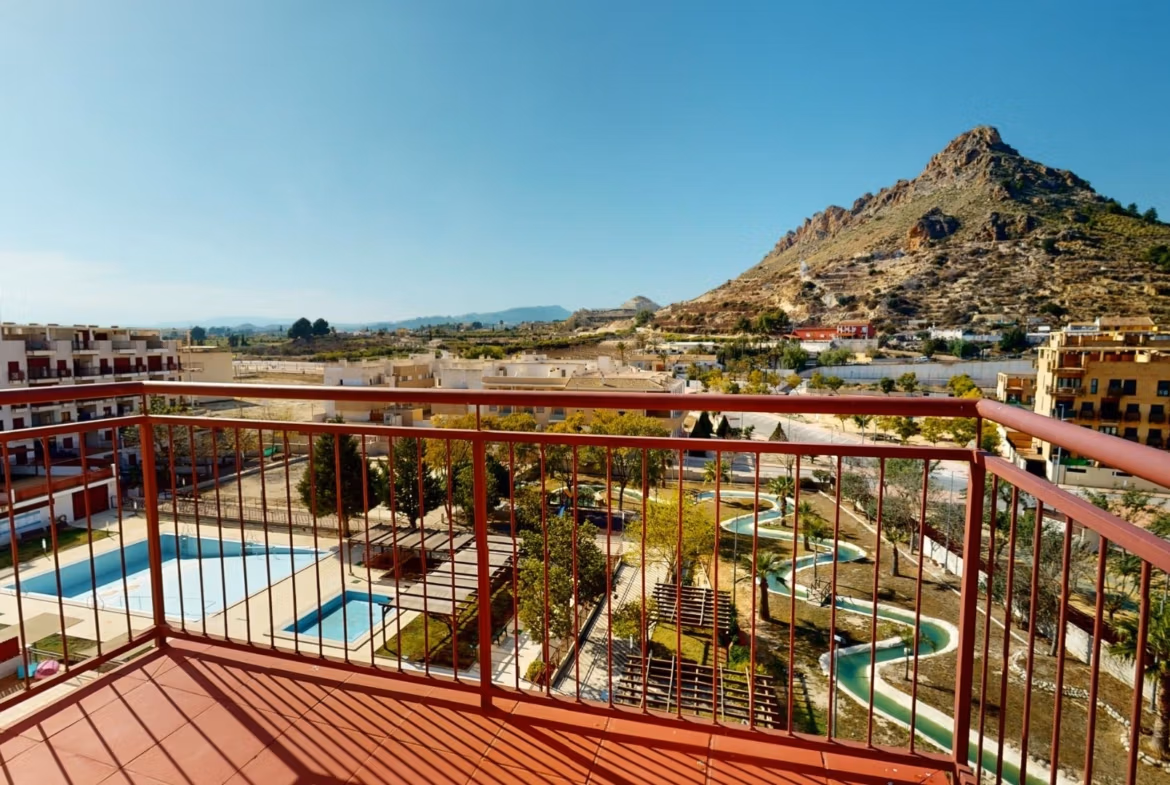 Panoramic sun-drenched terrace with pool views from spacious 2 bedroom penthouse near Archena, Murcia.