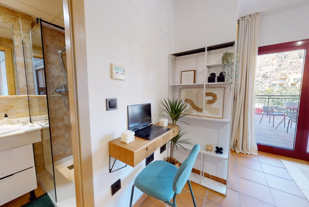Bright, modern 1-bedroom apartment with stylish workspace, sleek bathroom, and spacious terrace in Villanueva del Rio Segura near Archena.