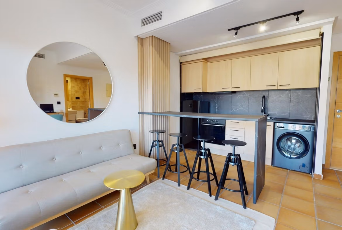 Bright and modern open-plan kitchen and living area in charming 1-bedroom apartment for sale in Villanueva del Rio Segura near Archena.