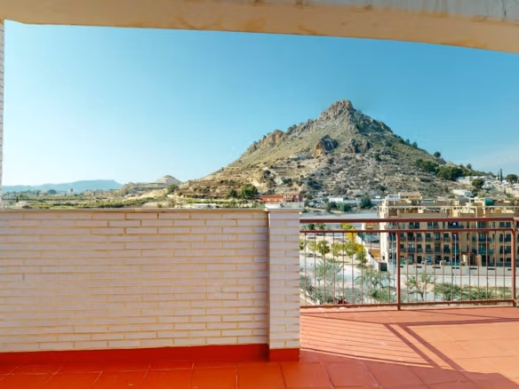 Spacious sunlit solarium terrace with panoramic mountain views at a luxury 2-bedroom penthouse near Archena, Murcia.