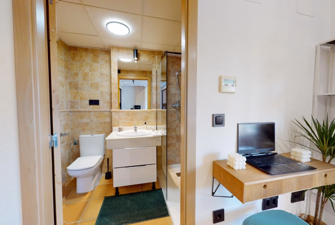 Bright modern bathroom and compact workspace in charming key-ready 1-bedroom apartment in Villanueva del Rio Segura near Archena.