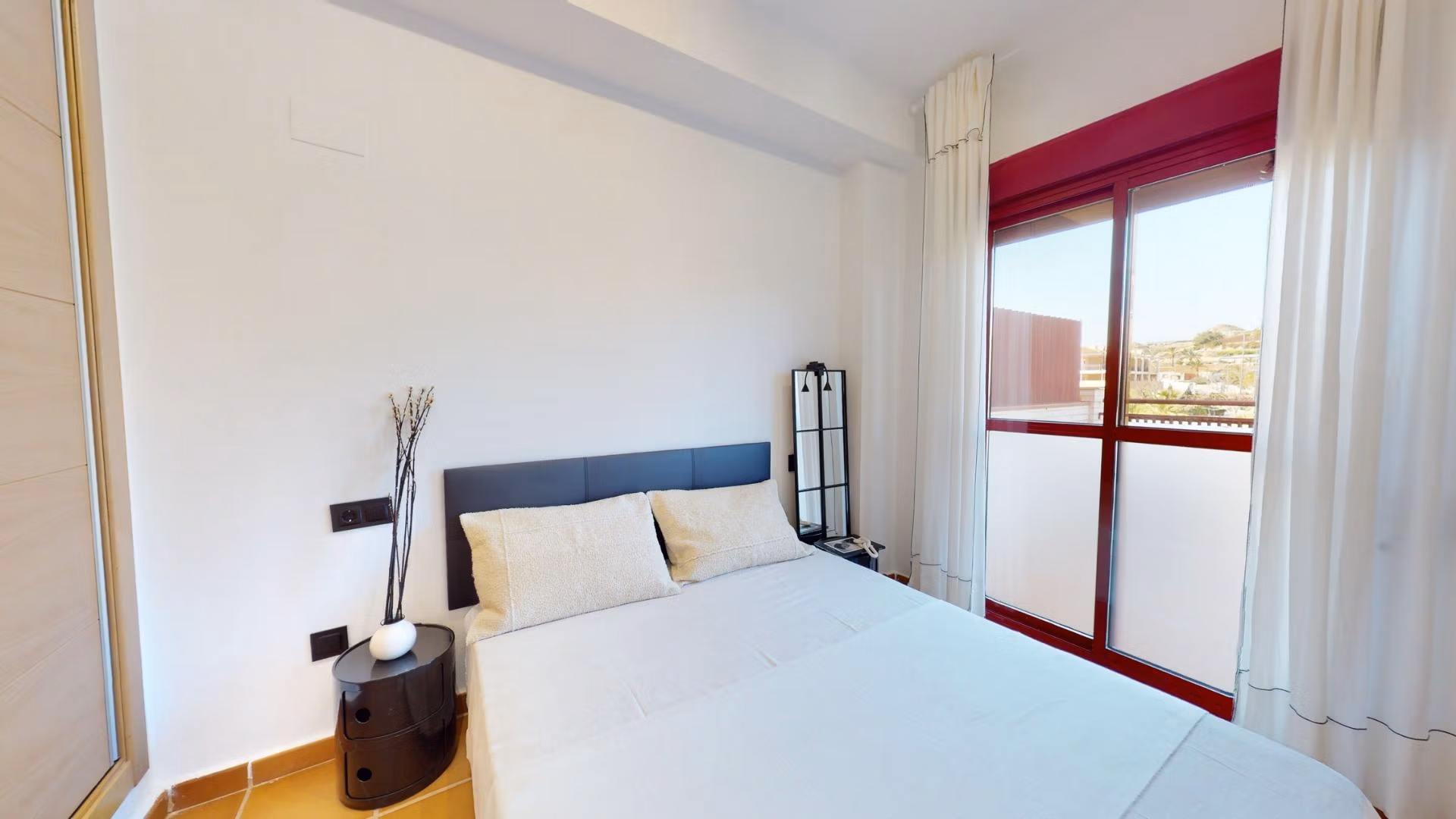 Bright and airy 1-bedroom apartment bedroom with modern decor and balcony, charmingly located in Villanueva del Rio Segura near Archena.