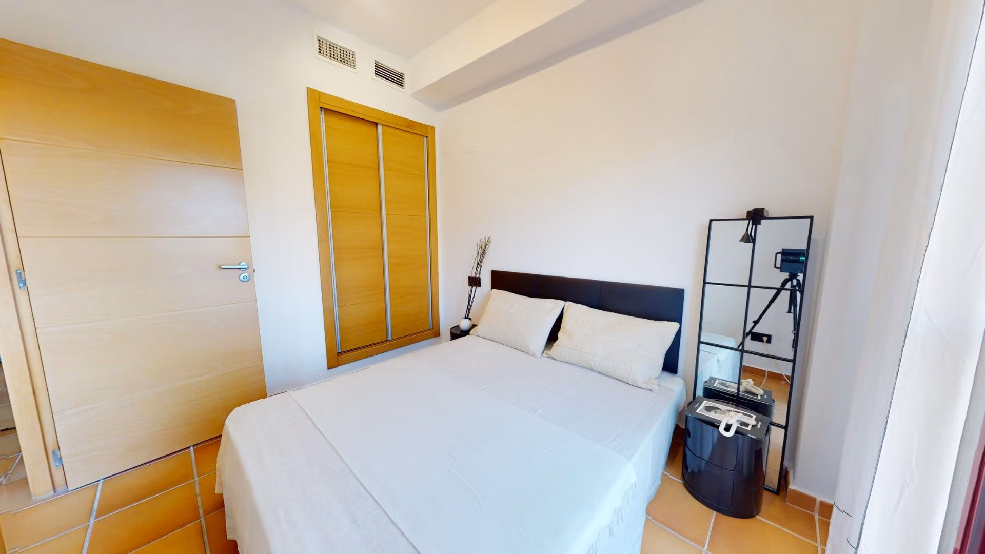 Bright and airy bedroom with modern furnishings in a charming 1-bedroom apartment for sale in Villanueva del Rio Segura near Archena.