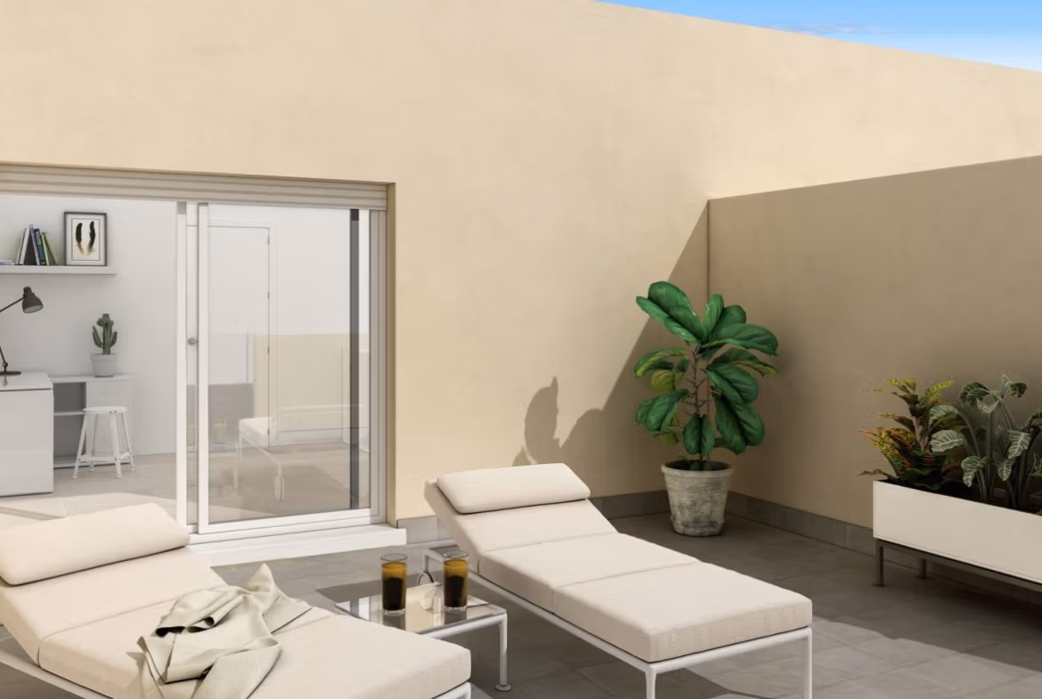 Sunlit private terrace with elegant loungers and greenery in a spacious new build 3-bedroom townhouse in La Manga del Mar Menor.