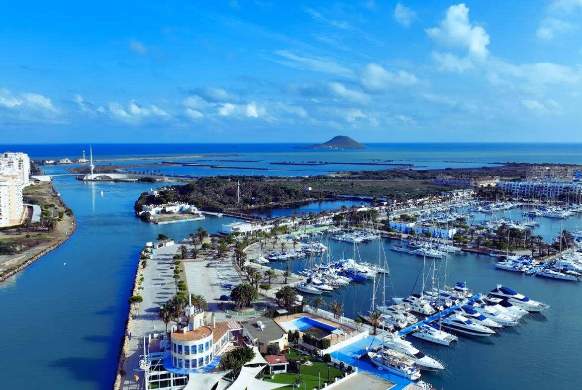 Panoramic views of a vibrant marina and sparkling sea from a spacious new build 3-bedroom townhouse in La Manga del Mar Menor.