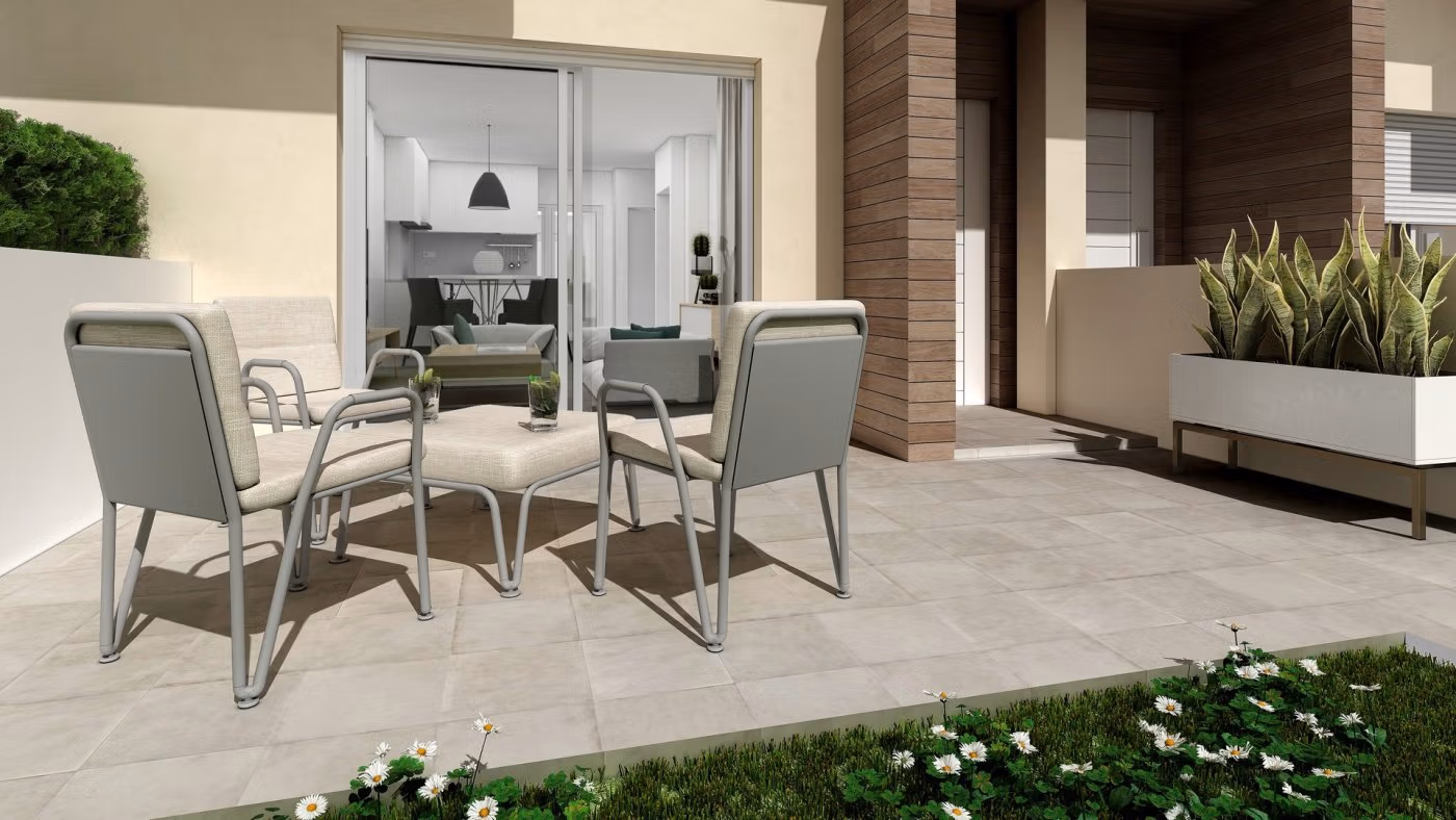 BEAUTIFUL-TOWNHOUSES-IN-LA-MANGA-3 Modern spacious 3-bedroom townhouse terrace with elegant outdoor seating and lush garden in La Manga del Mar Menor new build.